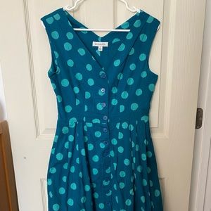 Tea-length dress from Emily & Fin. Fully lined, button front, pockets!